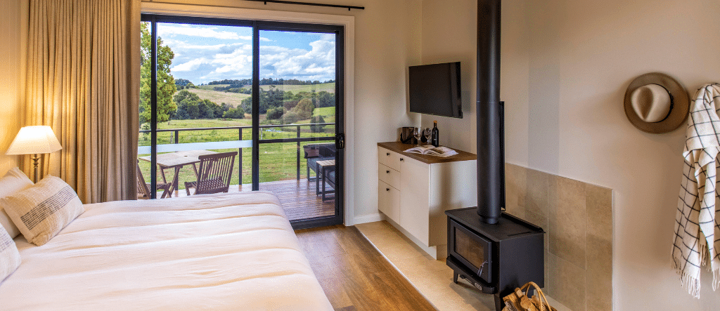 King Farm Cabin interior featuring luxe farm-house aesthetic and views of the hinterland.
