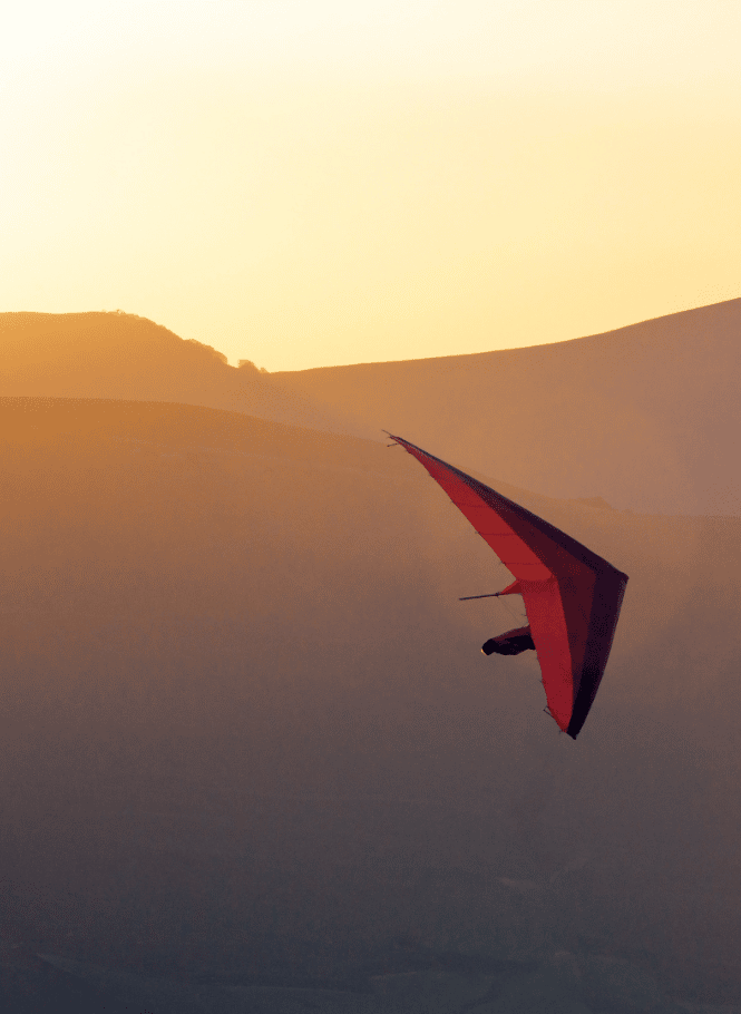 Hang gliding at sunrise in the hinterland